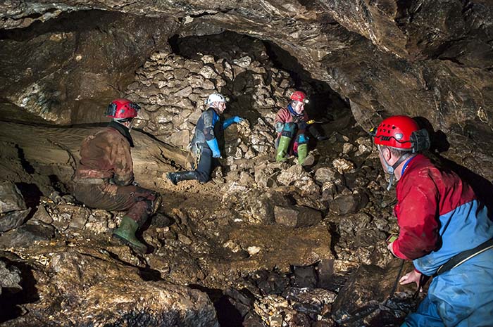 Lisa Wootton, Dave Shearsmith, Wayne Sheldon and Nigel Ball surveing the Lower Bung Stopes entrance. Photo: Phil Wolstenholme